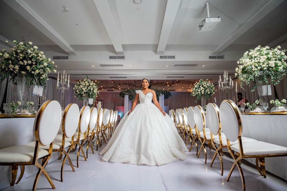 Ballroom reception with gold chairs