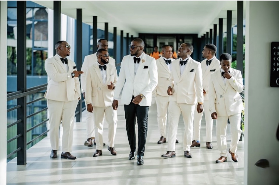 Groom and groomsmen in cream suits
