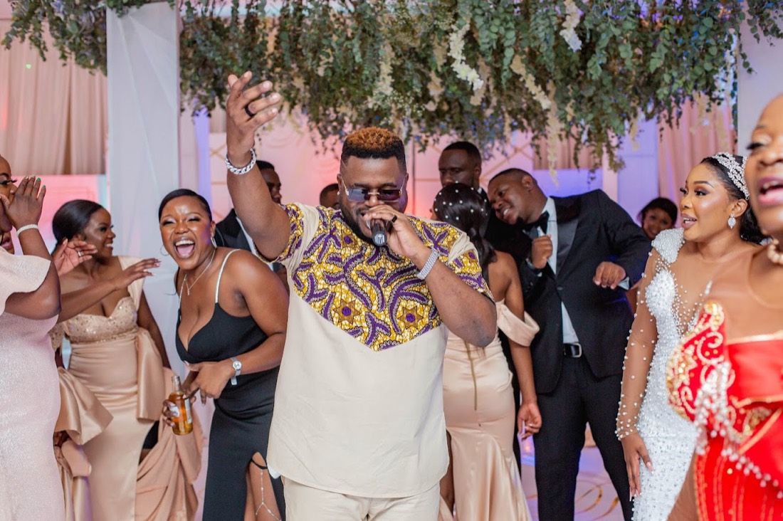 MC on the mic at an indoor reception